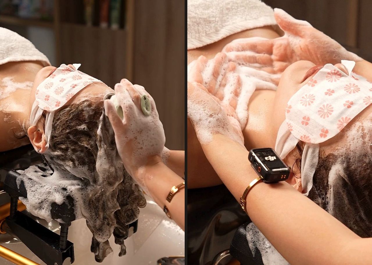 Two close-ups from the Head Therapy ASMR ad: hands massaging the foamy scalp of a guest wearing an eye mask